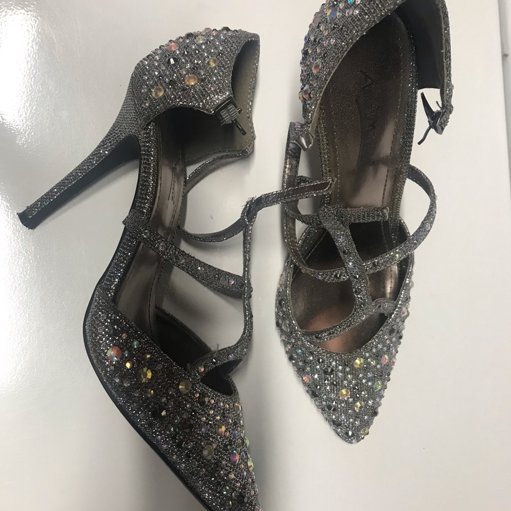 New shoes, silver with straps in the front.